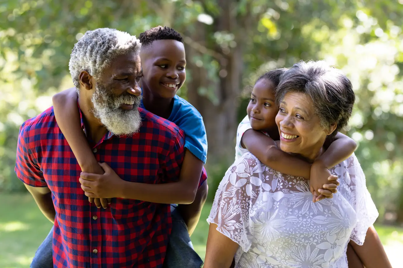 A grandparents smiling with their child
