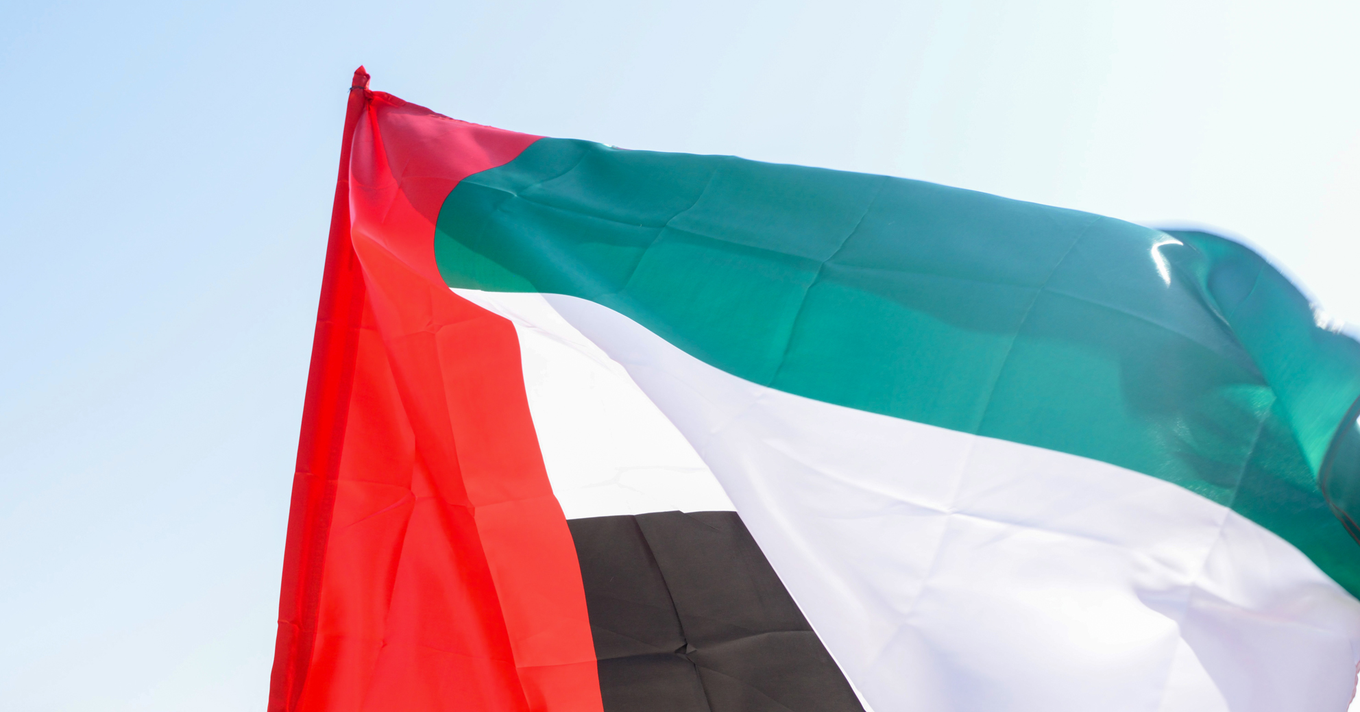 UAE flag waved in the wind. New UAE visa eases expat retirement worries