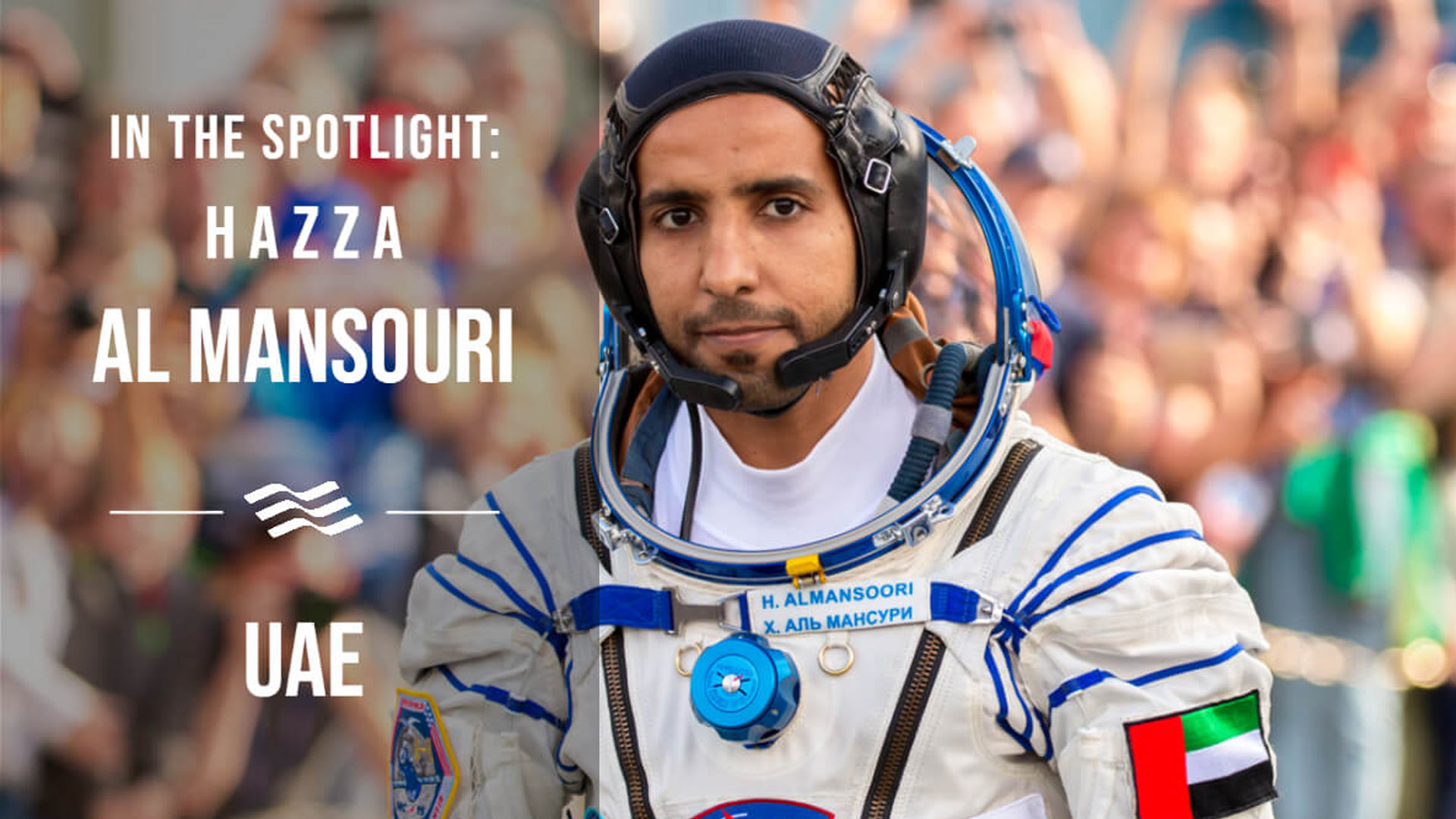 An image of Hazza Al Mansouri wearing a spacesuit with the writing saying In the Spotlight: Hazza Al Mansouri. UAE