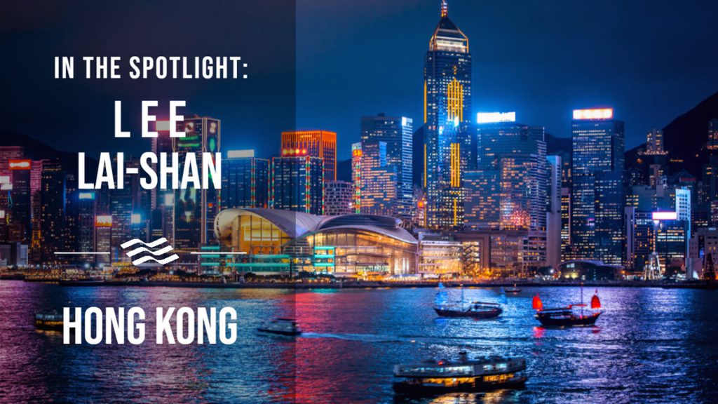 An image of Hong Kong by night with writing in white letters saying In The Spotlight: Lee Lai-Shan. Hong Kong